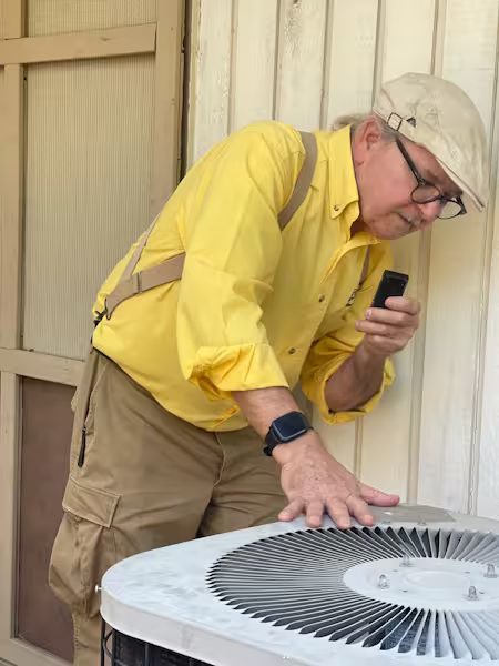 Inspector checking outdoor ac unit